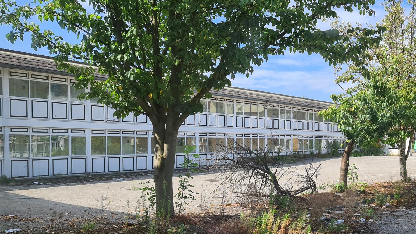 Vacant commercial building requiring scheduled property inspections